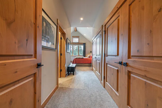 a view of a hallway with living room and furniture