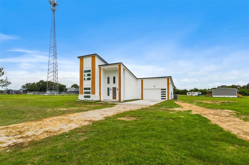 180 County Road 2245 Emory, TX 75440 - Photo 29 of 34 a house view with a garden space