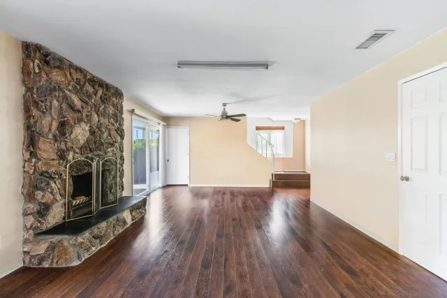 an aerial view of residential building with green space