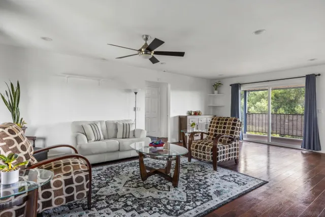 a kitchen with a table chairs and a chandelier