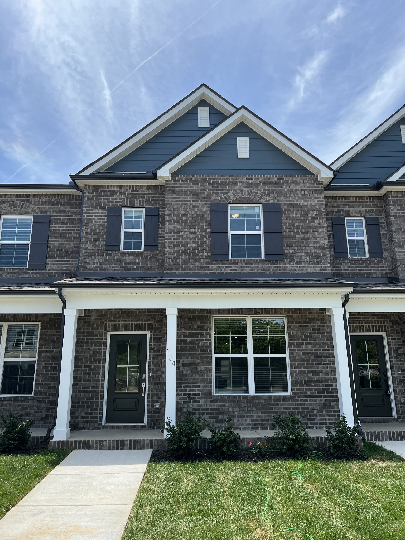 154 Jackson Alan Drive Murfreesboro, TN 37130 - Photo 1 of 10 a front view of a house with garden