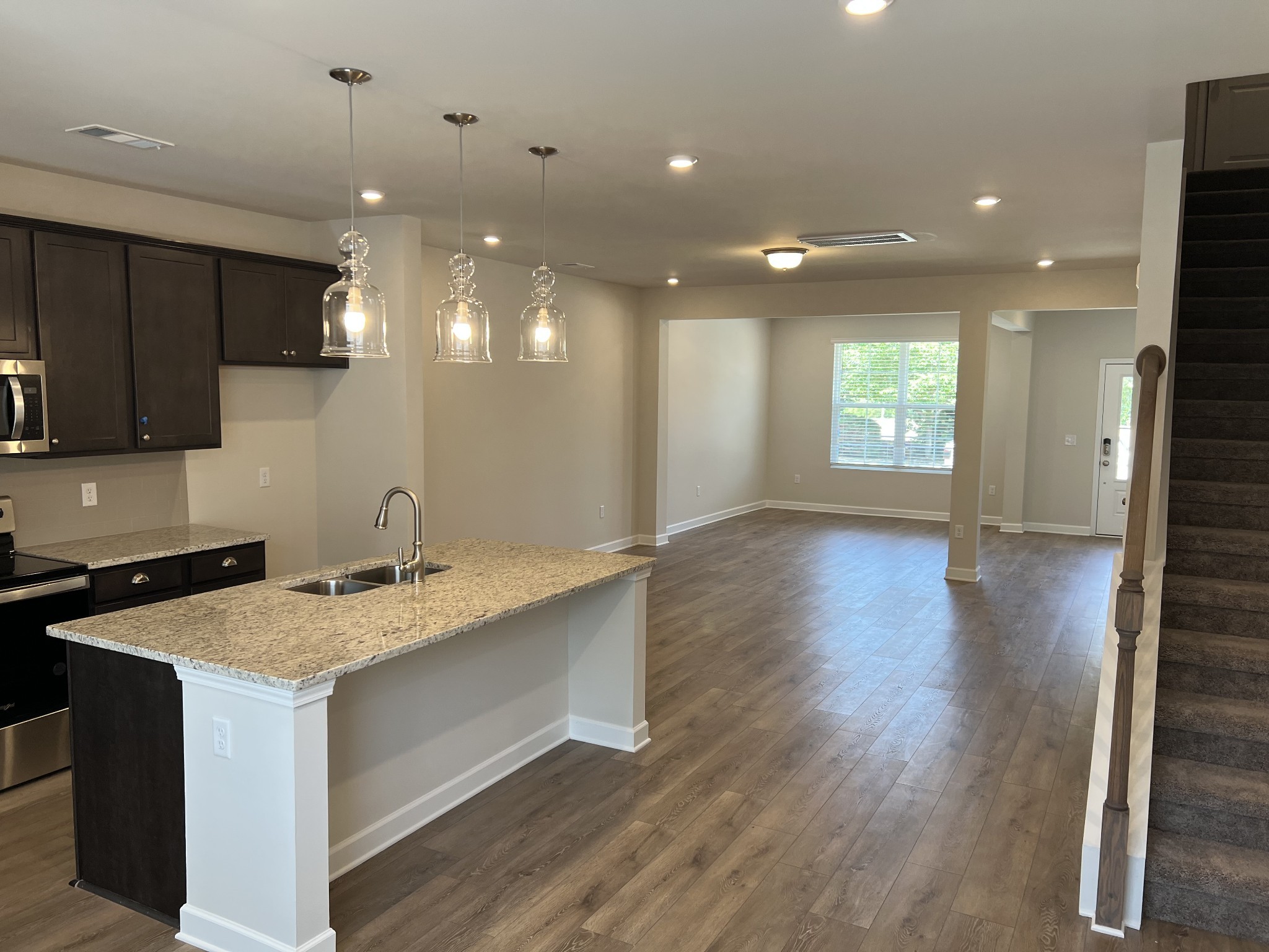 154 Jackson Alan Drive Murfreesboro, TN 37130 - Photo 3 of 10 a kitchen with a sink stainless steel appliances and cabinets