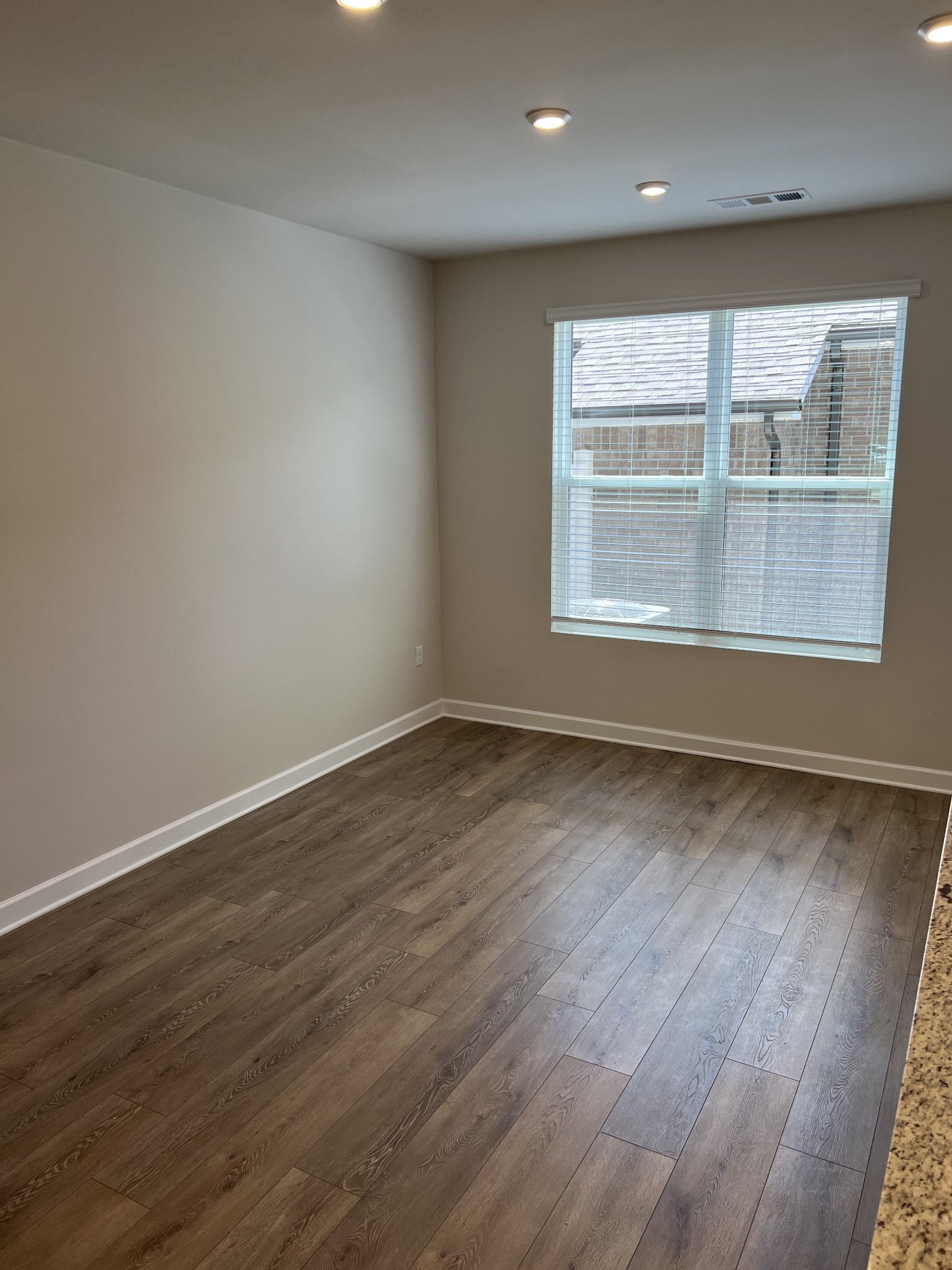 154 Jackson Alan Drive Murfreesboro, TN 37130 - Photo 4 of 10 an empty room with wooden floor and windows