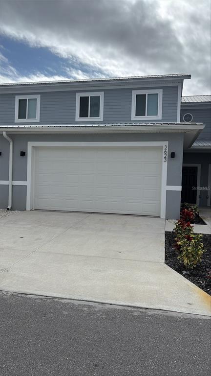 a front view of a house with yard