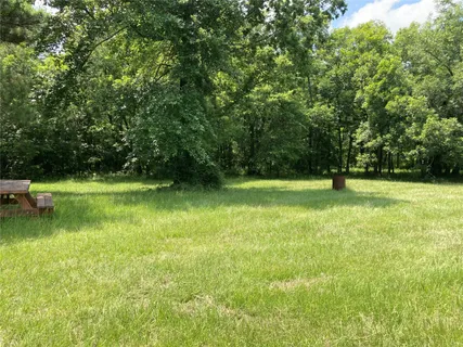 a view of swimming pool with a yard