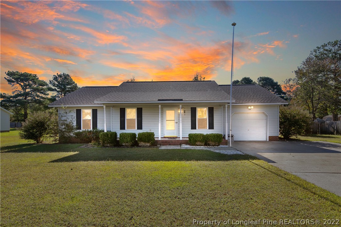 7455 Elliott Bridge Road Spring Lake, NC 28390 - Photo 1 of 49 a front view of a house with a yard