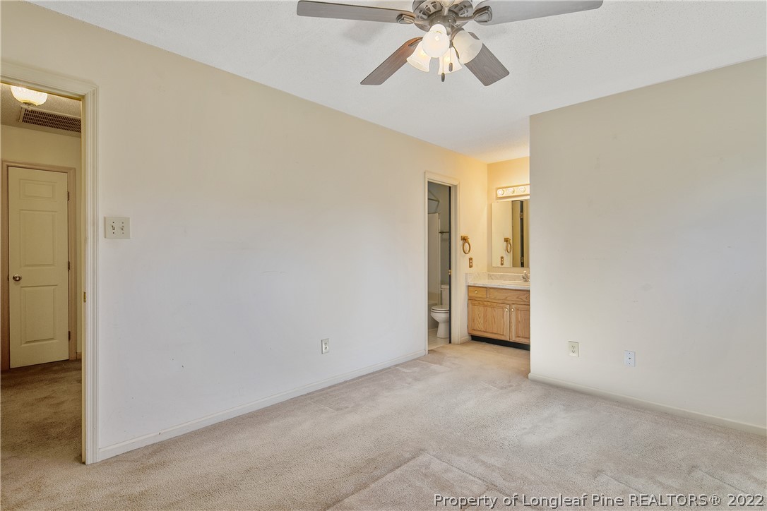 7455 Elliott Bridge Road Spring Lake, NC 28390 - Photo 29 of 49 a view of an empty room with a chandelier fan