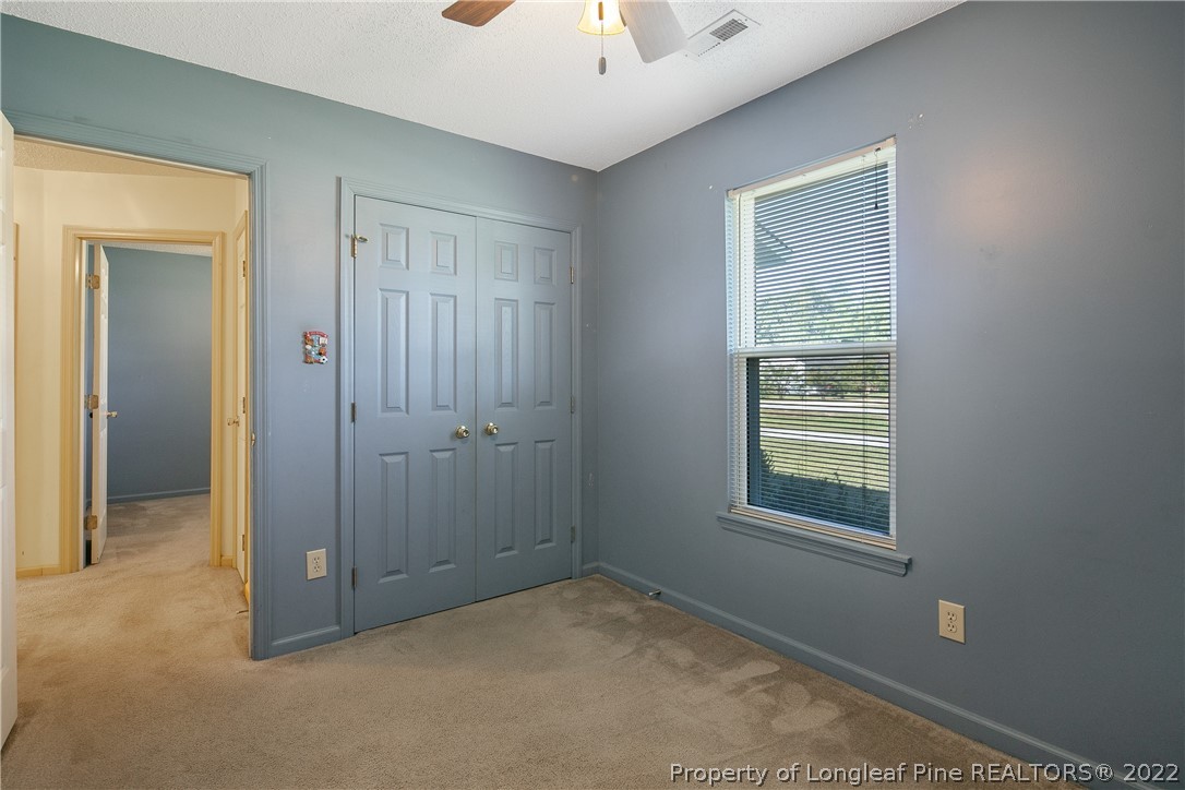 7455 Elliott Bridge Road Spring Lake, NC 28390 - Photo 44 of 49 a view of an empty room with a window