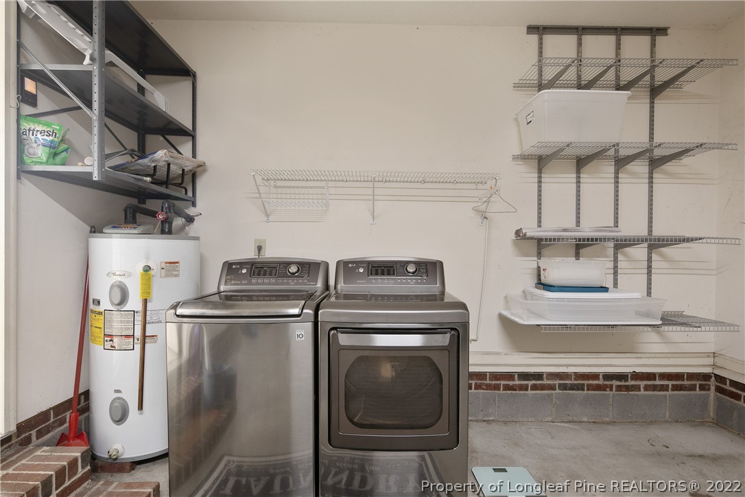 7455 Elliott Bridge Road Spring Lake, NC 28390 - Photo 45 of 49 a kitchen with a stove and a refrigerator