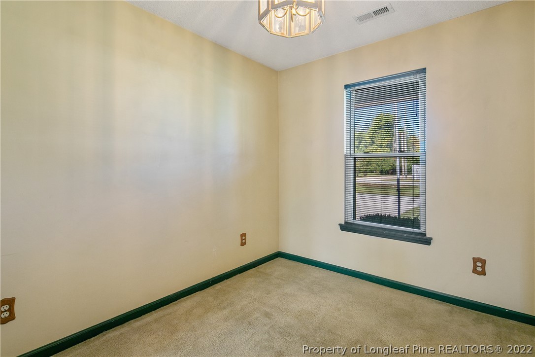 7455 Elliott Bridge Road Spring Lake, NC 28390 - Photo 9 of 49 an empty room with a window