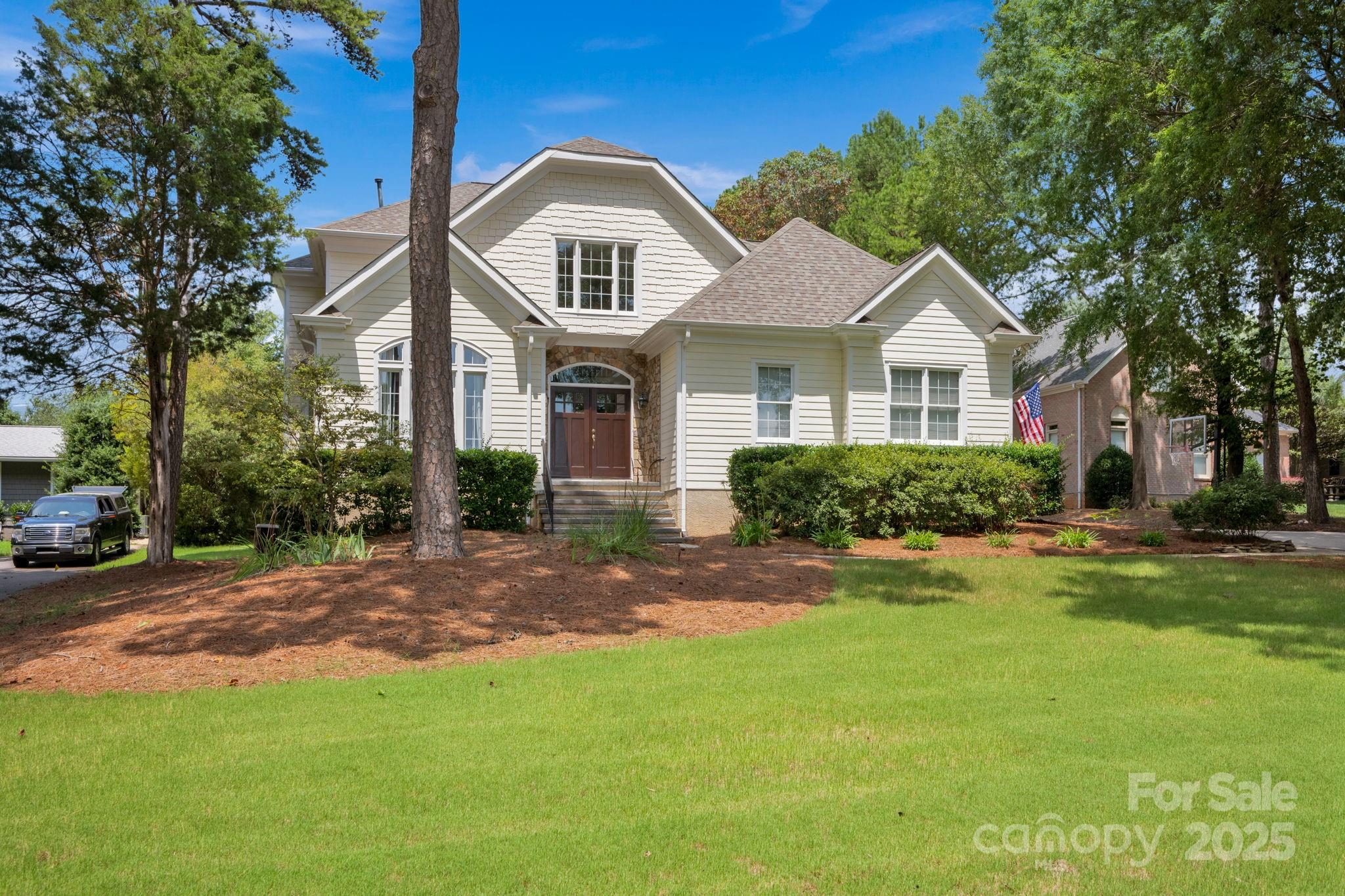 a front view of a house with a yard