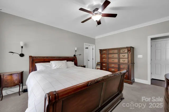 a bed room with a bed and a chandelier