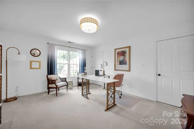 a work room with furniture and window