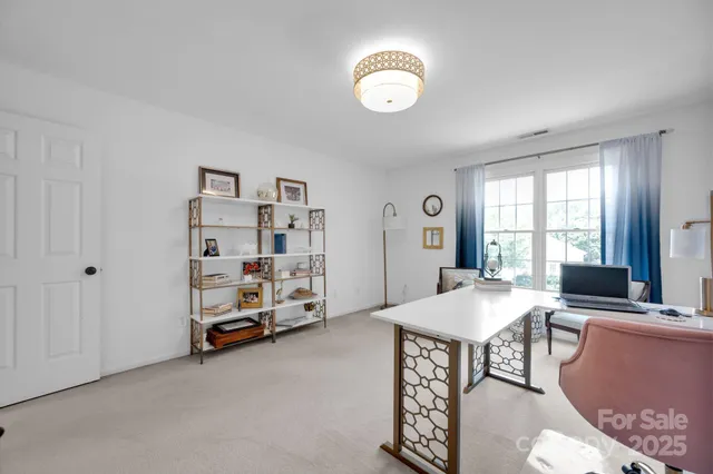 a view of a livingroom with furniture and window