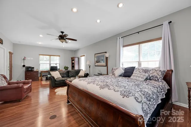 a bedroom with a large bed and a couch