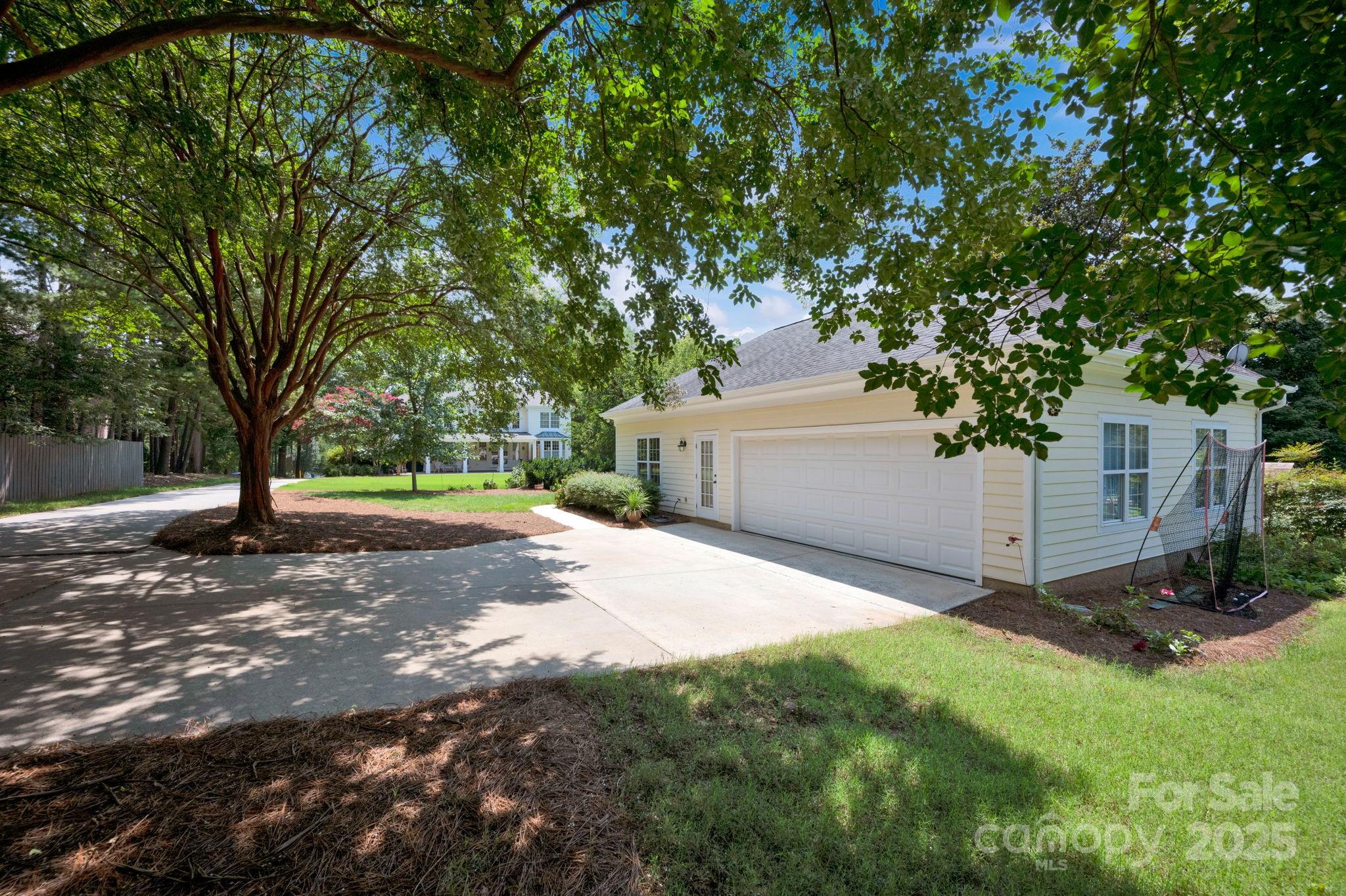 19577 Meta Road Cornelius, NC 28031 - Photo 4 of 45 a view of a yard with plants and tree