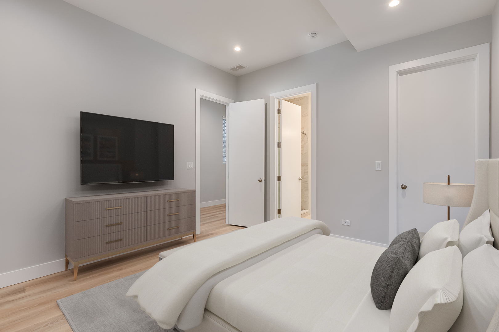 864 North State Street, Unit 2 Chicago, IL 60610 - Photo 12 of 21 a bedroom with a bed and a flat screen tv