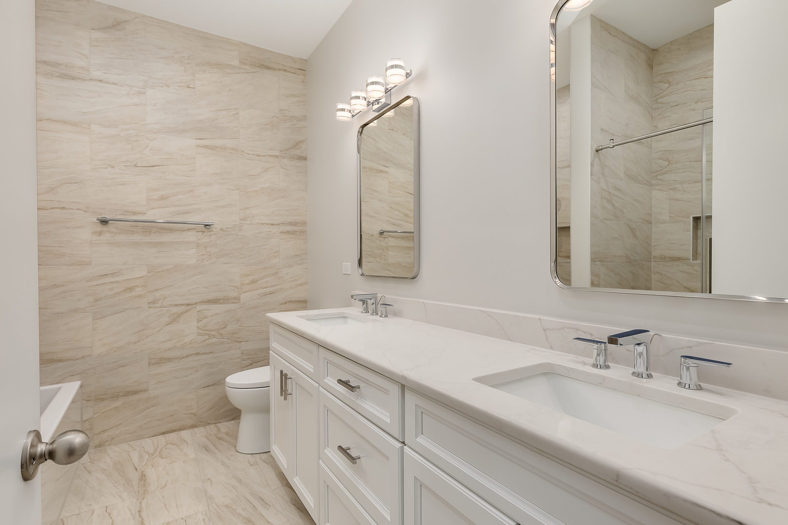 864 North State Street, Unit 2 Chicago, IL 60610 - Photo 14 of 21 a bathroom with a double vanity sink toilet and a mirror