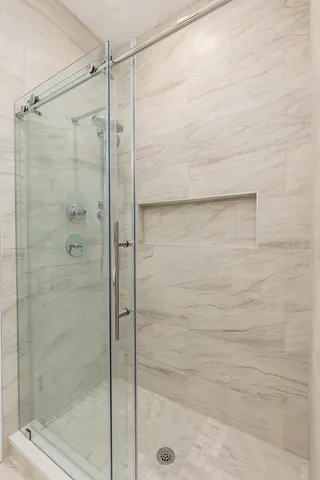 a bedroom with a bed and a lamp