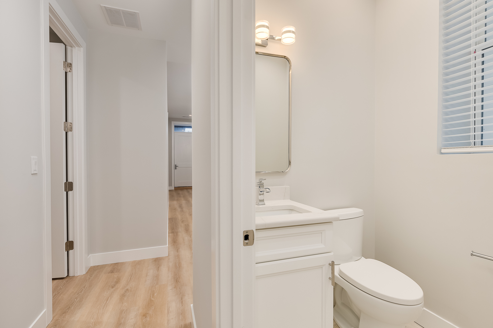 864 North State Street, Unit 2 Chicago, IL 60610 - Photo 18 of 21 a bathroom with a toilet a sink and mirror