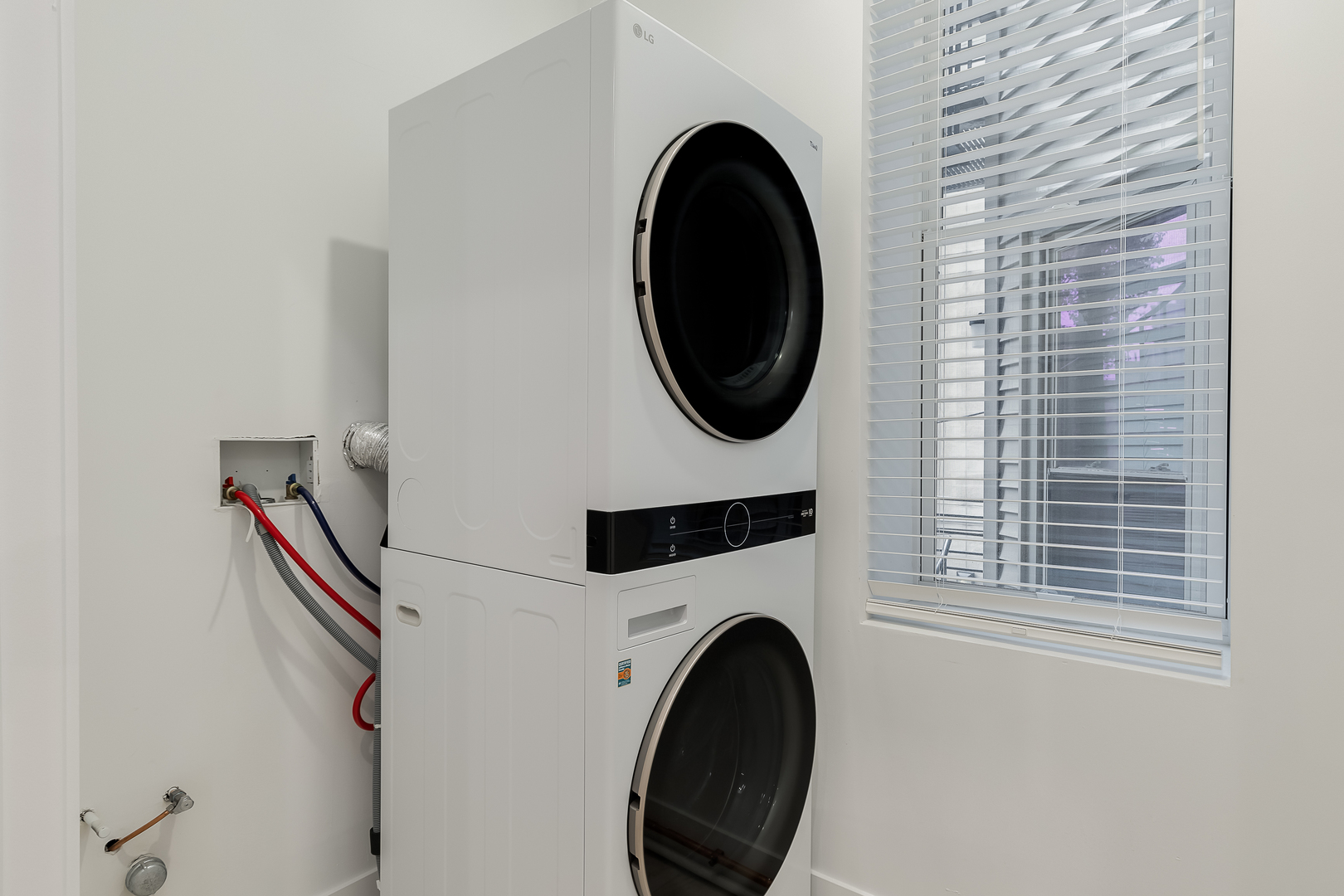 864 North State Street, Unit 2 Chicago, IL 60610 - Photo 19 of 21 a close view of a utility room with dryer and washer