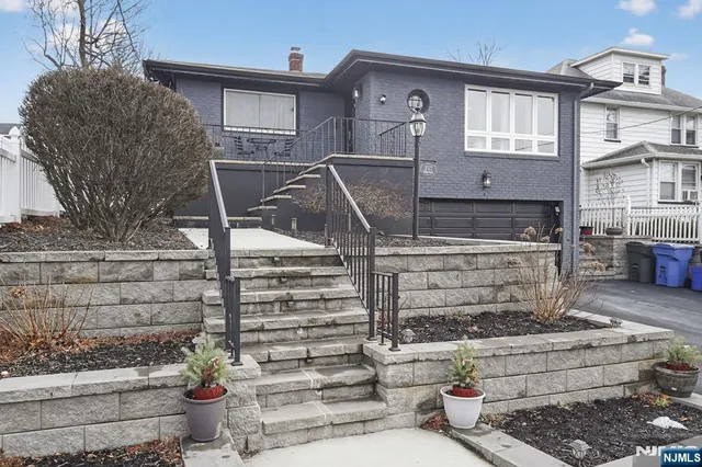 a front view of a house with outdoor space