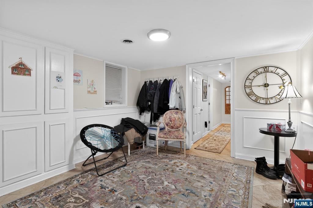 317 Ridge Road Rutherford, NJ 07070 - Photo 12 of 32 a living room with furniture a rug and a window