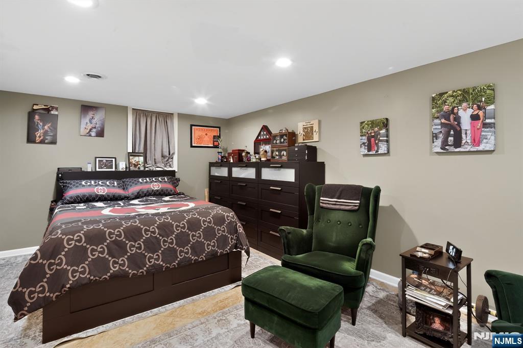 317 Ridge Road Rutherford, NJ 07070 - Photo 20 of 32 a bedroom with a bed and a couch