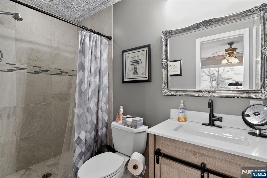 317 Ridge Road Rutherford, NJ 07070 - Photo 28 of 32 a bathroom with a sink toilet and shower