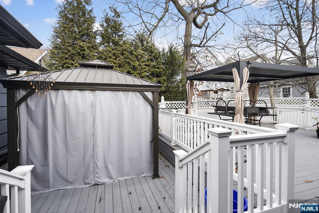 317 Ridge Road Rutherford, NJ 07070 - Photo 5 of 32 a view of outdoor space with wooden deck and furniture