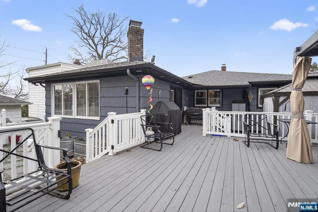 317 Ridge Road Rutherford, NJ 07070 - Photo 6 of 32 a view of a chair and tables in the patio
