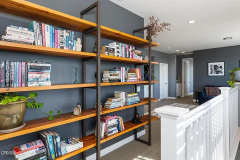 a room with furniture and a book shelf
