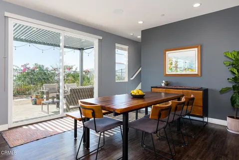 a view of a dining room with furniture wooden floor and a window