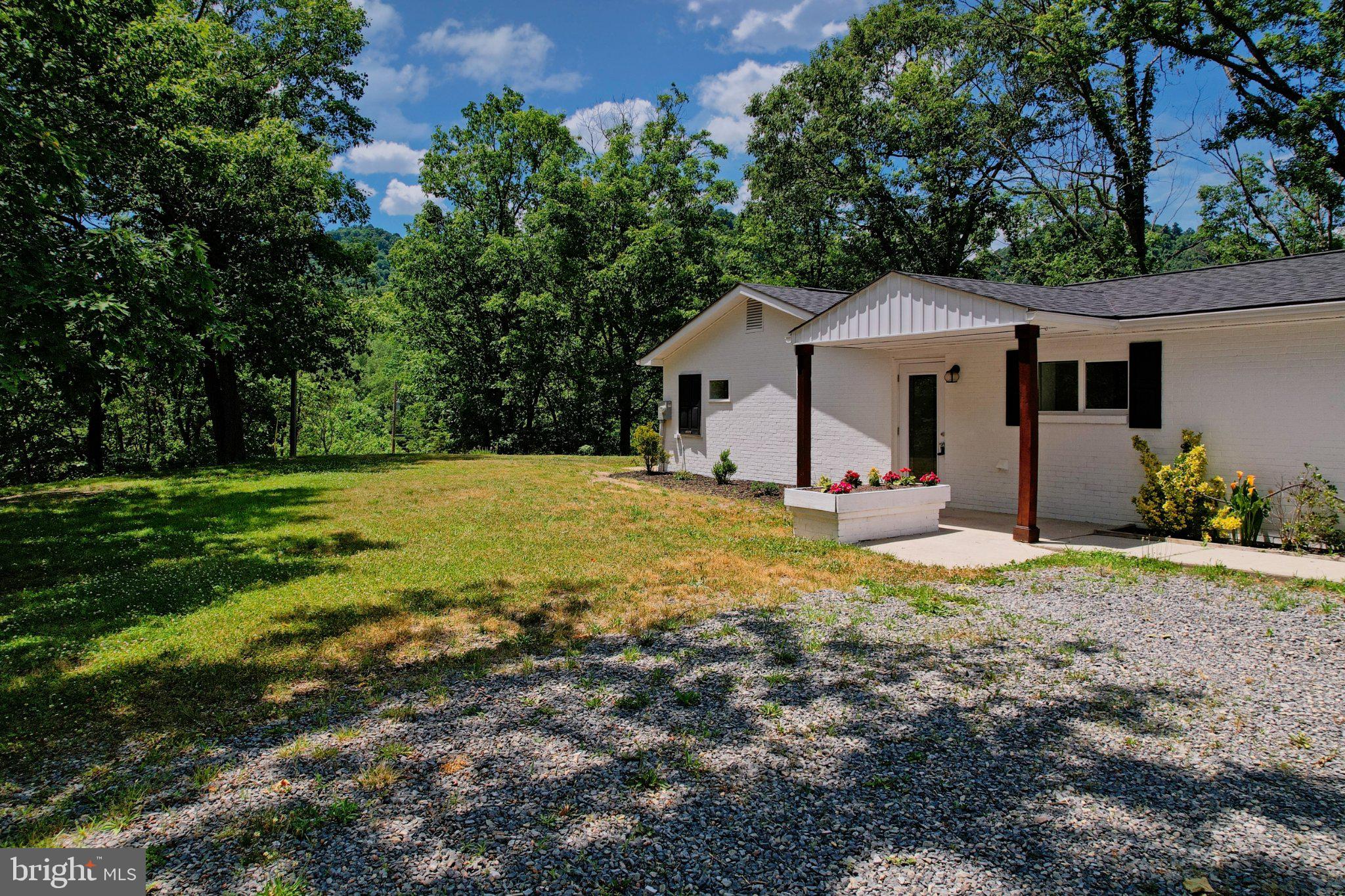 125 Ashland Drive Ridgeley, WV 26753 - Photo 38 of 41 Serene retreat amidst lush greenery.