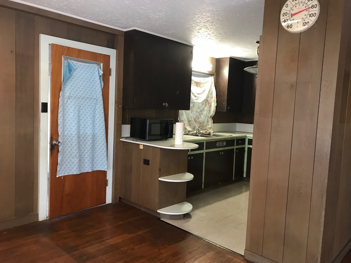81-1048 Captain Cook Road Captain Cook, HI 96704 - Photo 5 of 10 a kitchen with a sink and a refrigerator