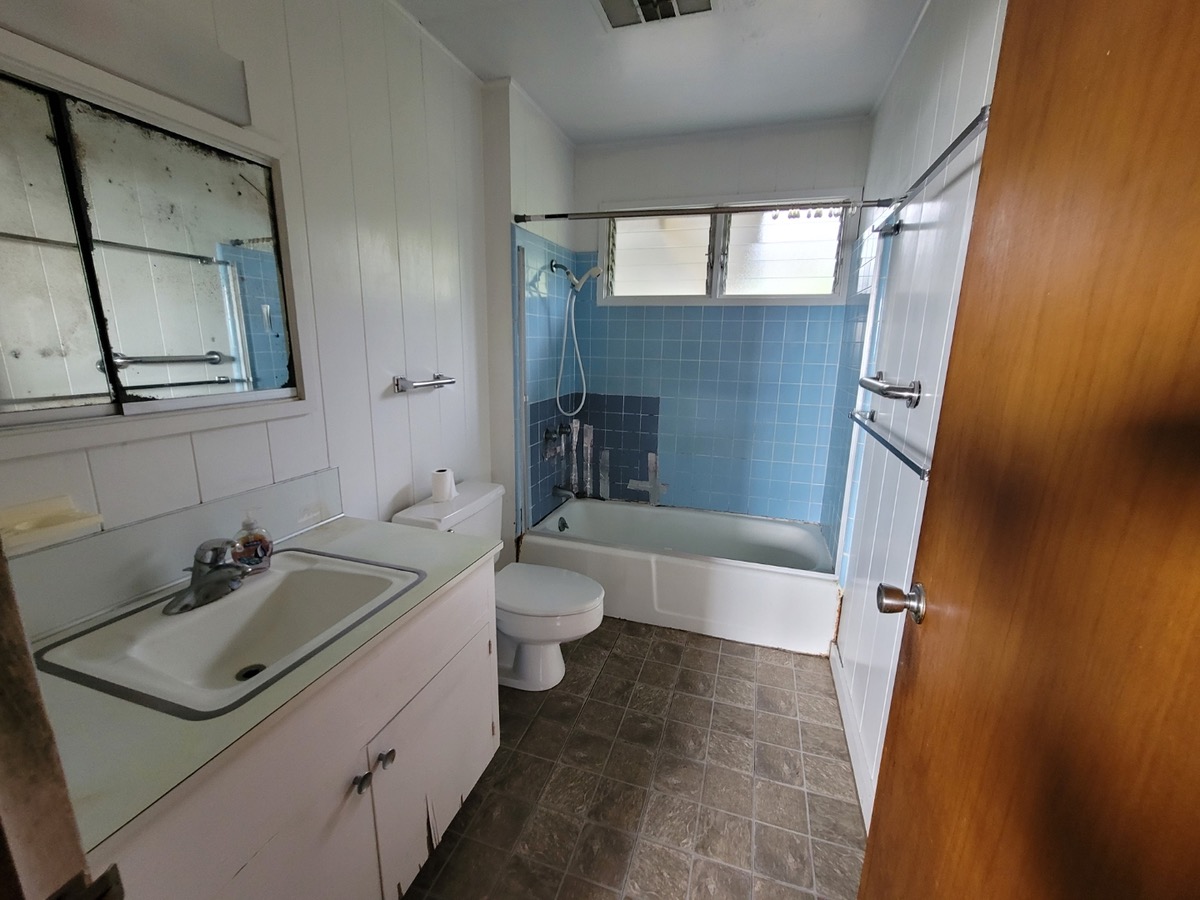 81-1048 Captain Cook Road Captain Cook, HI 96704 - Photo 7 of 10 a bathroom with a sink and mirror with toilet