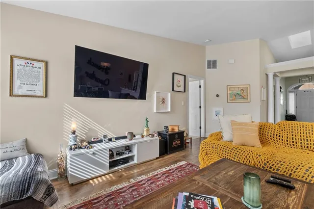 a bedroom with furniture and a rug