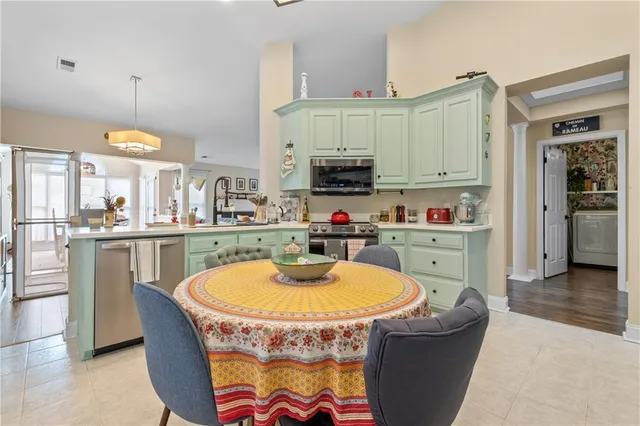 a view of a dining room with furniture window and outside view