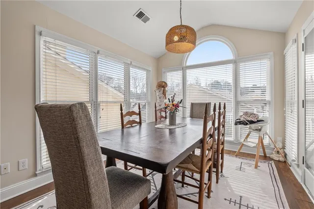 a view of a work space with furniture and wooden floor