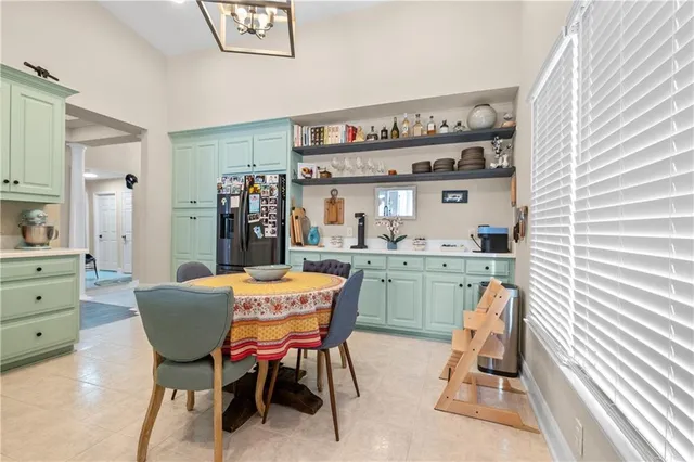 a bathroom with a sink mirror and toilet