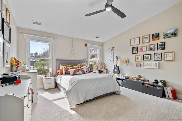 a bedroom with a bed furniture and window