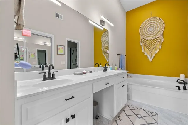 a bathroom with a sink and a bathtub