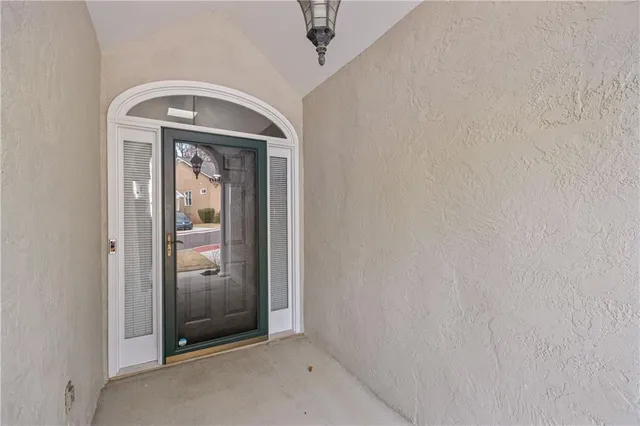 a view of front door with a mirror