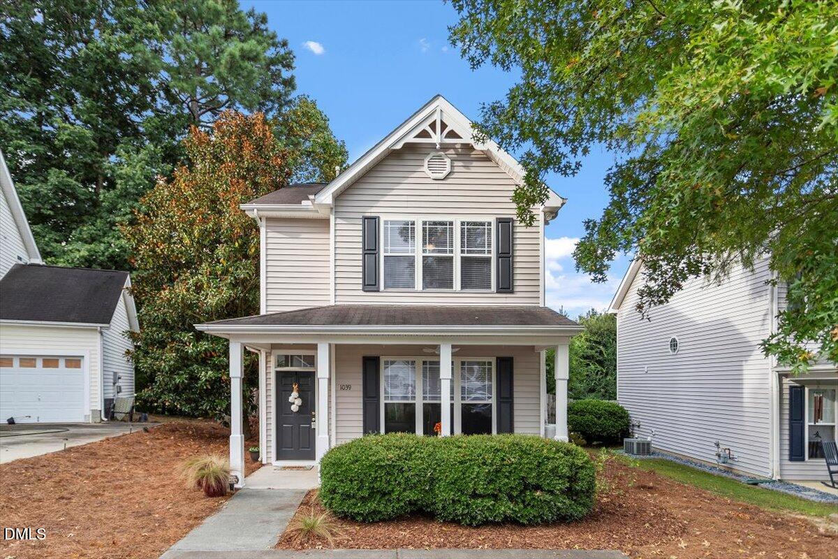 1039 Dual Parks Road Apex, NC 27502 - Photo 1 of 46 a front view of a house with a yard