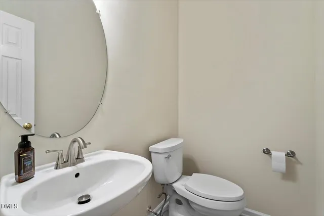 a kitchen with a refrigerator and a sink