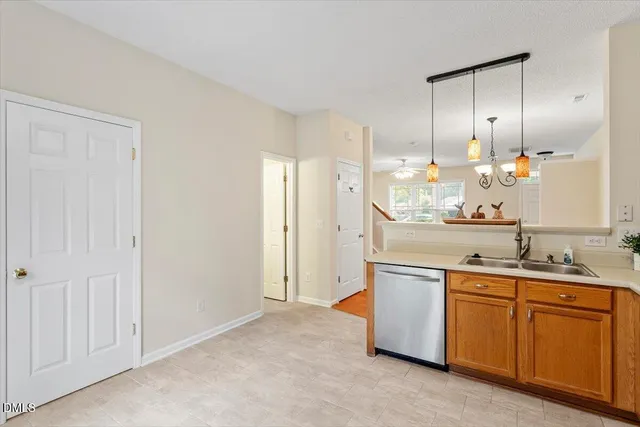 an empty room with window and a ceiling fan