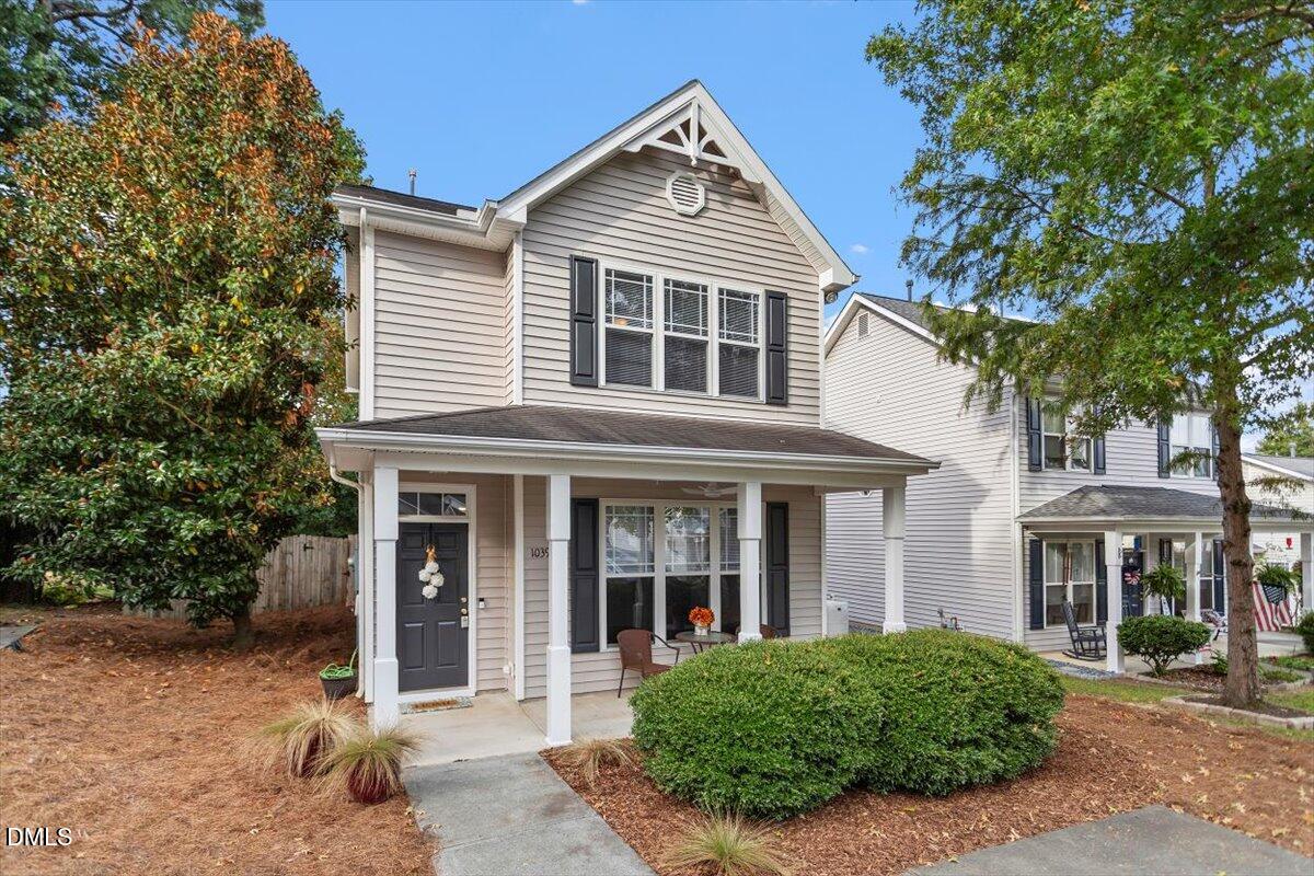 1039 Dual Parks Road Apex, NC 27502 - Photo 2 of 46 front view of a house with a yard