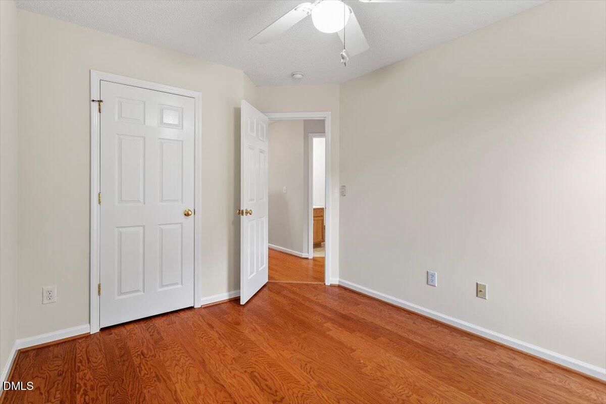 1039 Dual Parks Road Apex, NC 27502 - Photo 23 of 46 a view of empty room with wooden floor