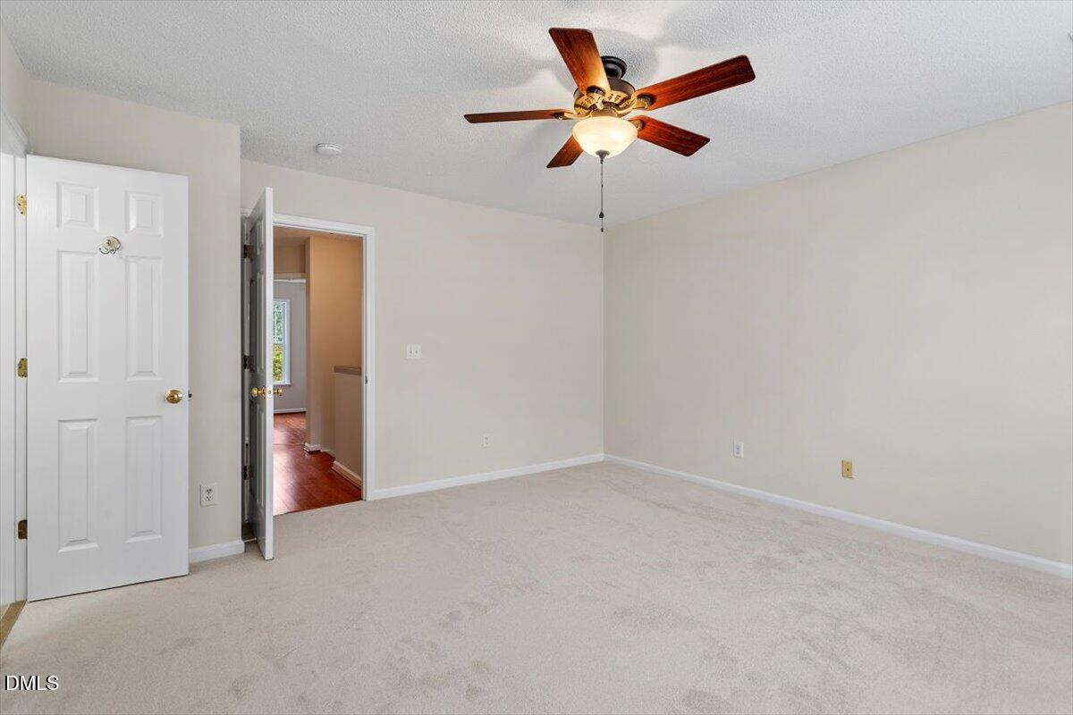 1039 Dual Parks Road Apex, NC 27502 - Photo 27 of 46 an empty room with closet and fan