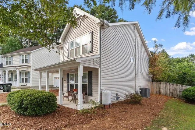 a view of a house with a yard and plants